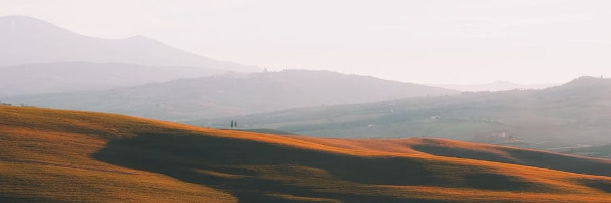 A panoramic view of a serene landscape at dusk, evoking a sense of calm.